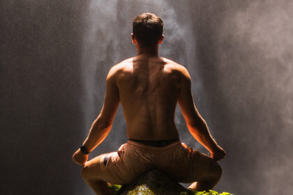 RikVentures meditating at waterfall in Bali.